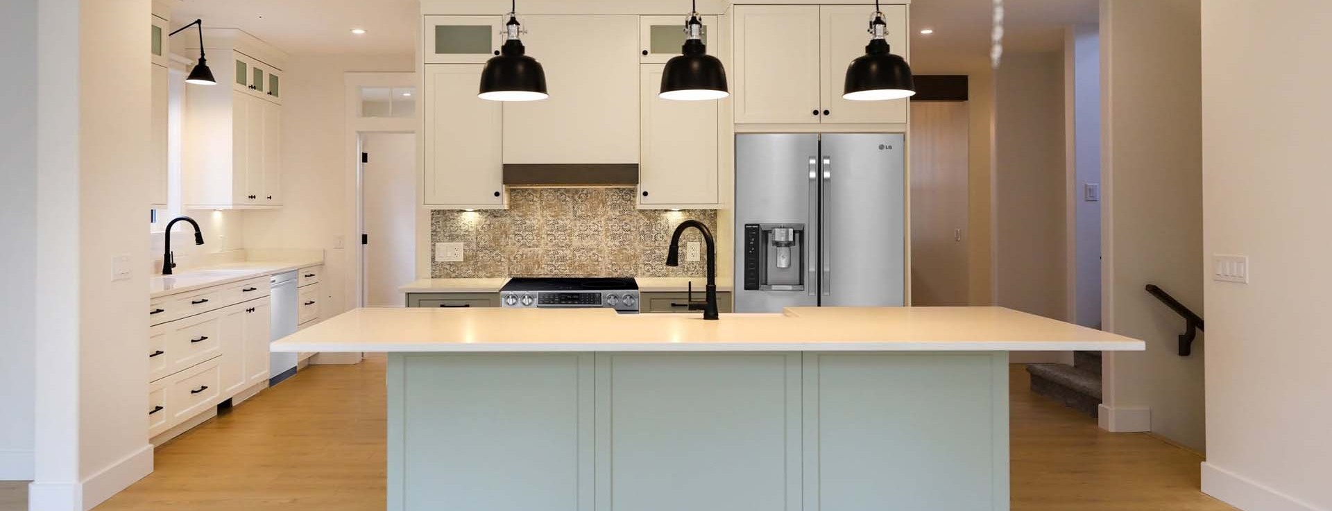 Matte black gooseneck faucet in a bright custom kitchen