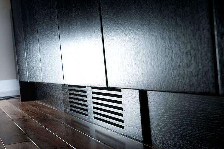 Detailed black cabinetry toe-kick venting
