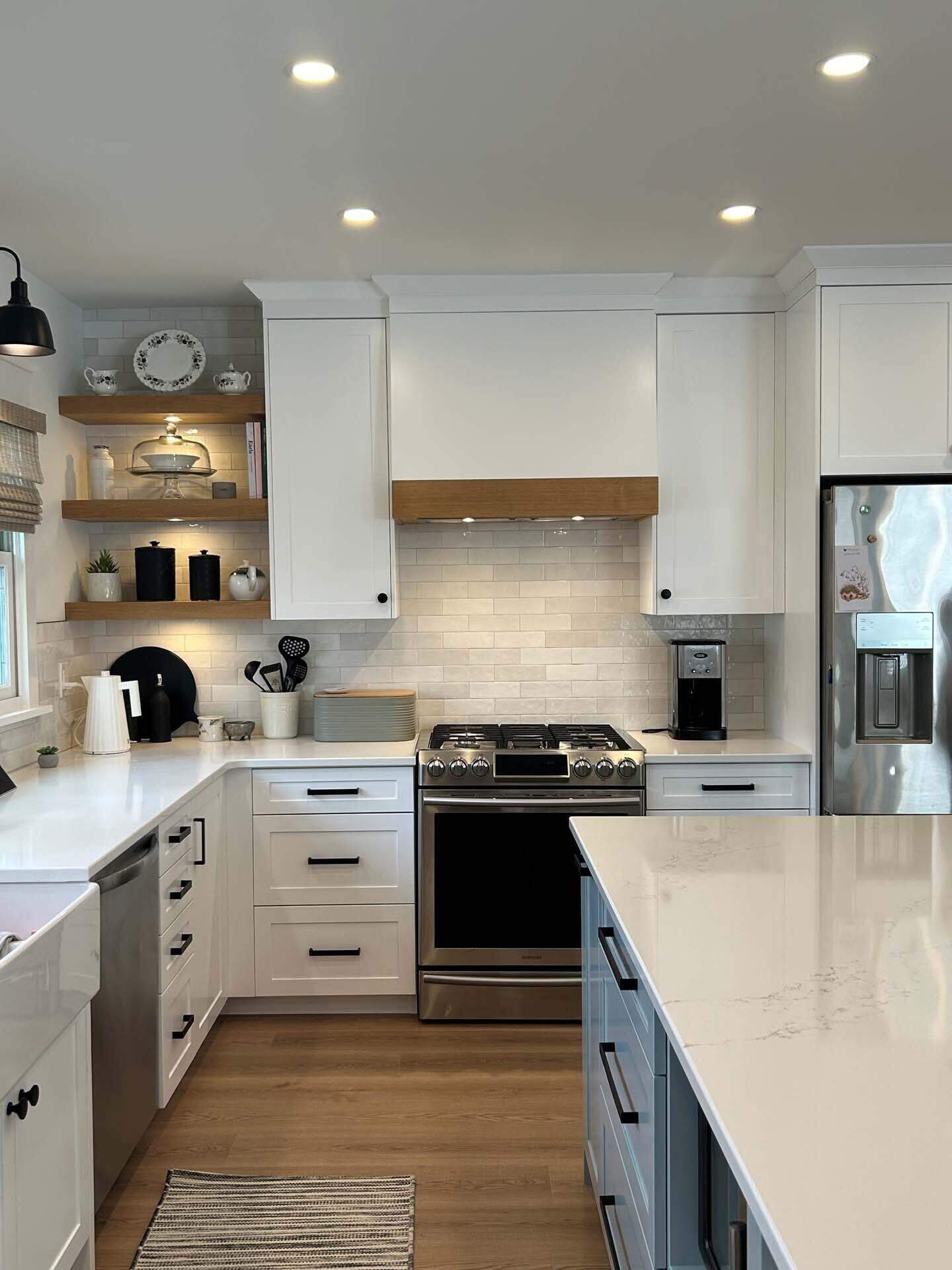 White kitchen with wood accents and island seating