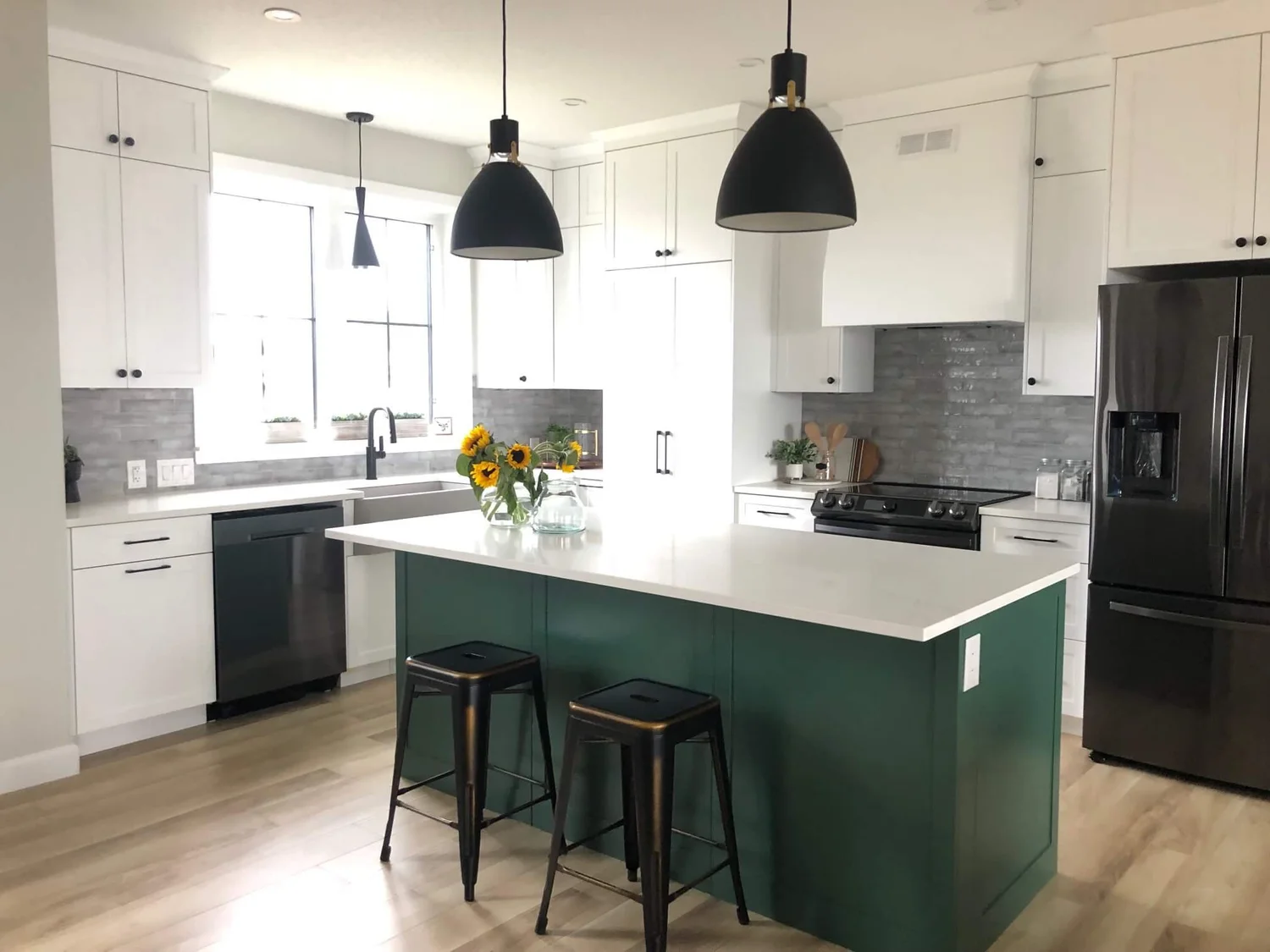 White kitchen with green island