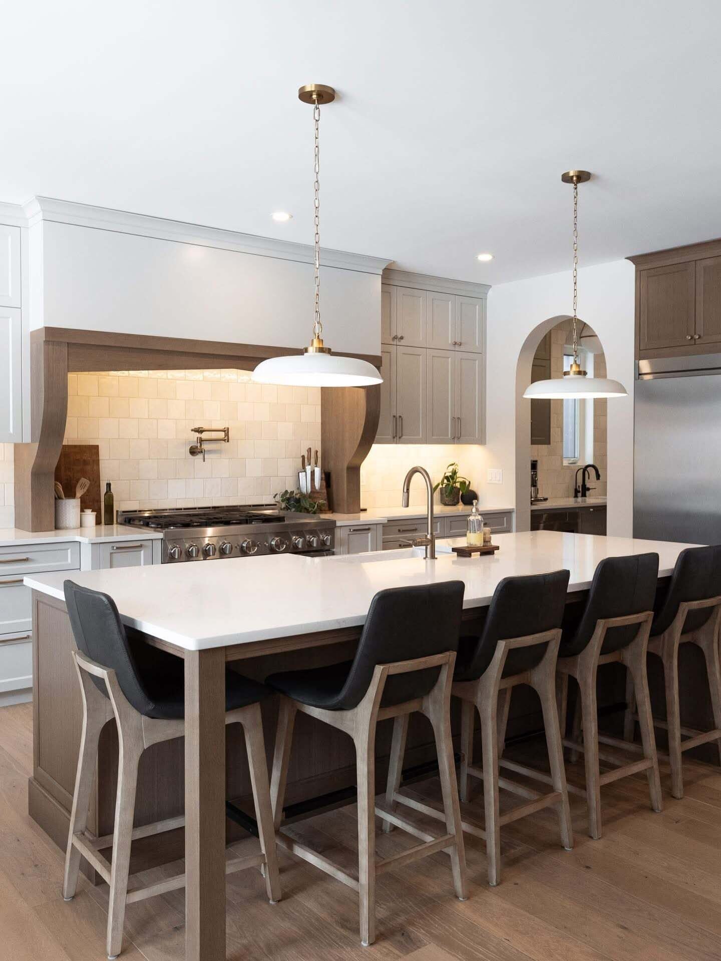 Bright kitchen with large island and pendant lighting
