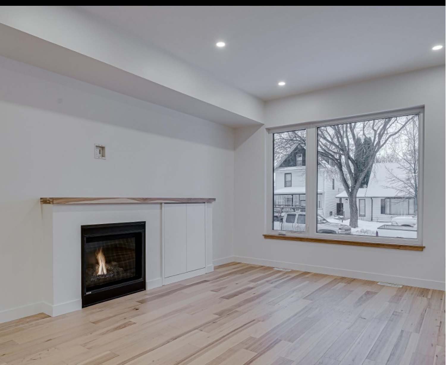 White fireplace with concealed cabinet