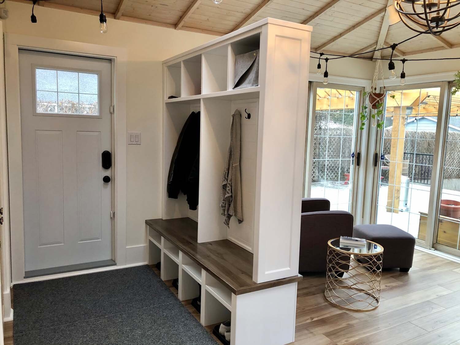 Wood bench entry with black powder room