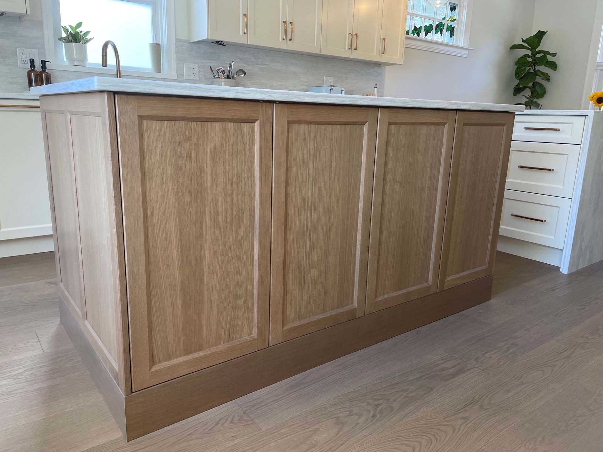 Custom wood island with painted perimeter cabinets