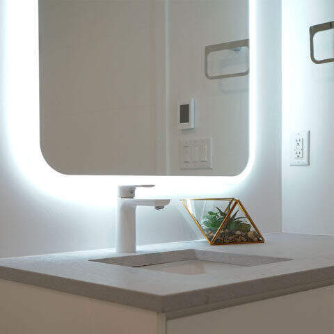 Modern bath sink with a backlit mirror